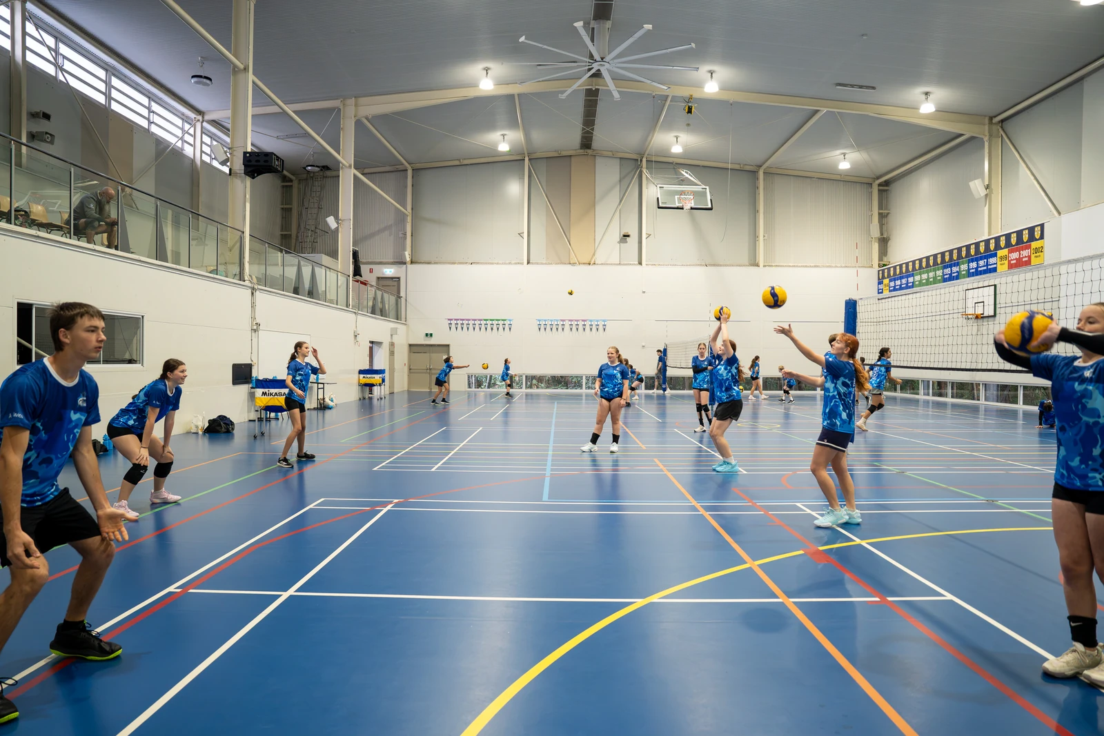 Sharks Volleyball camp athletes taking part in an active multi-ball training drill