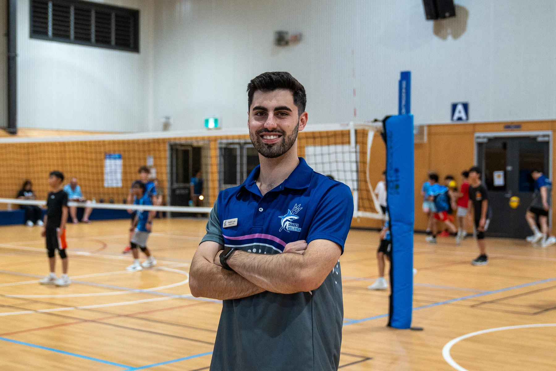 Sharks Volleyball founder Keaton Luck on court during a junior volleyball session