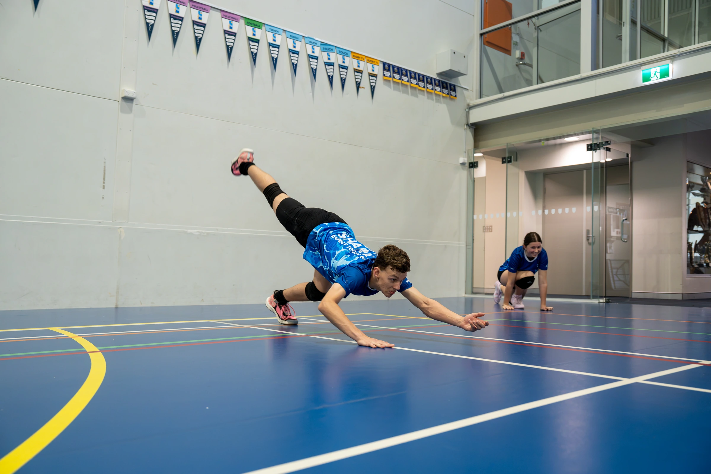 Sharks Camp athlete practising a defensive dive during volleyball training