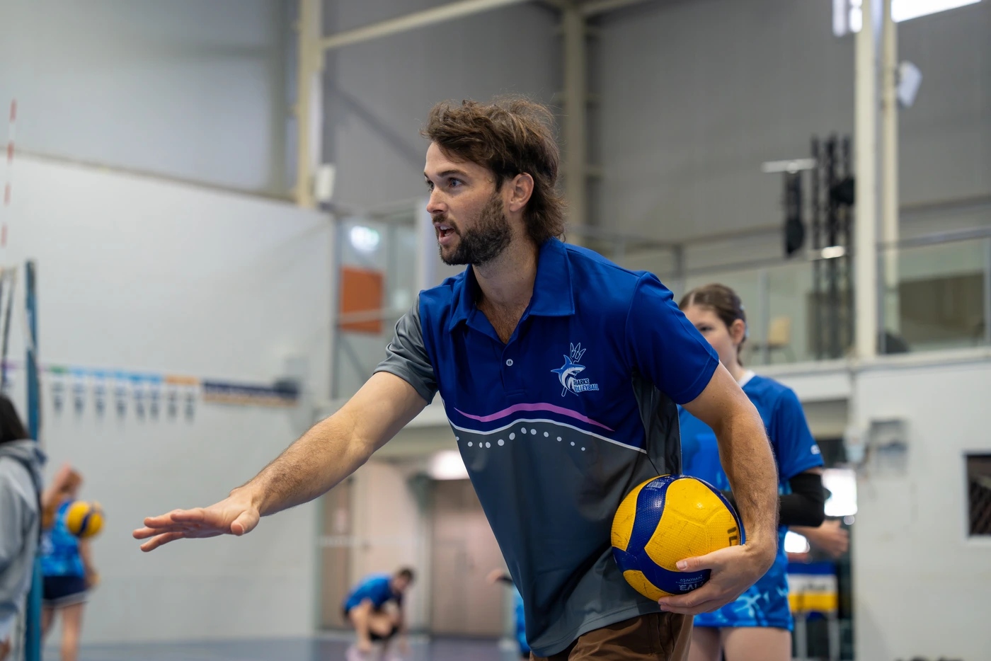 Sharks Camp coach leading volleyball training at Eagles Sports Complex